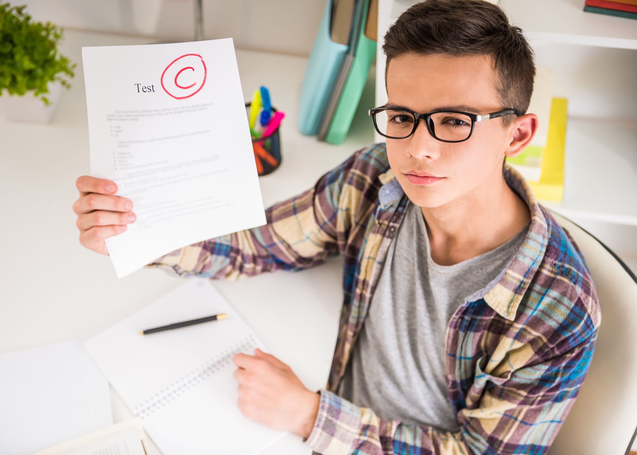 Un élève à une mauvaise note sur son bulletin